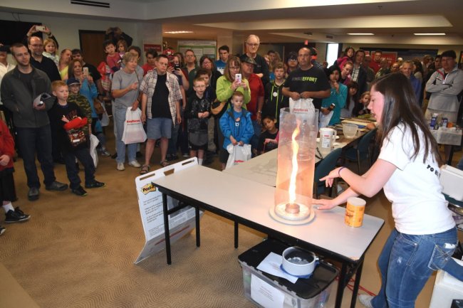 a staff member displaying a fire tornado