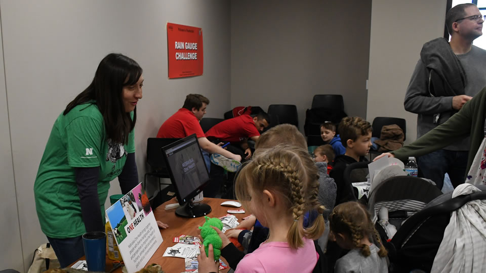 staff member giving demo to children