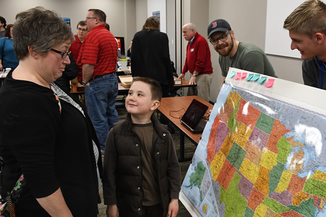 a kid showing their parent a map